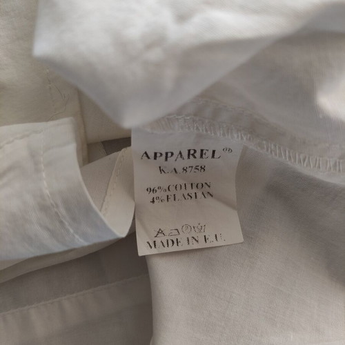 White short sleeve utility shirt with contrast stitching and waist strap