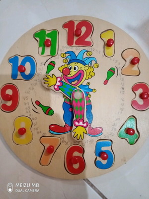 Educational wooden clock used with seconds display