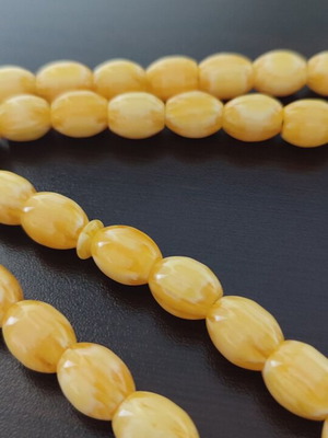 Handmade komboloi with 33 oval beads in yellow honey tone like new