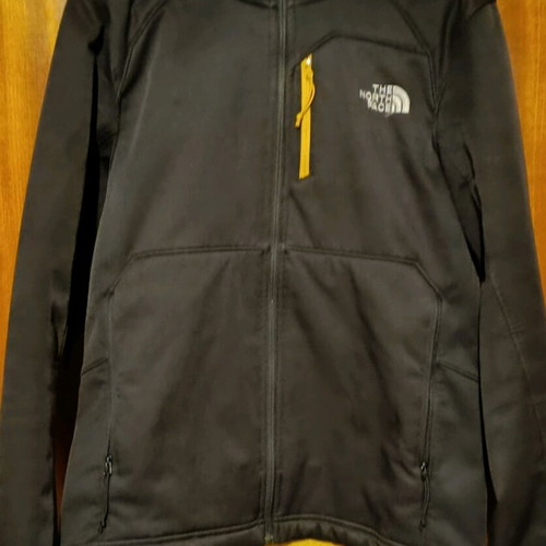 The North Face jacket used, size S, black and yellow