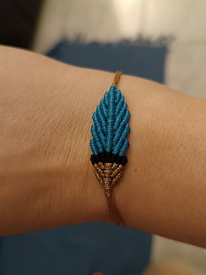 Macrame feather bracelet with adjustable clasp