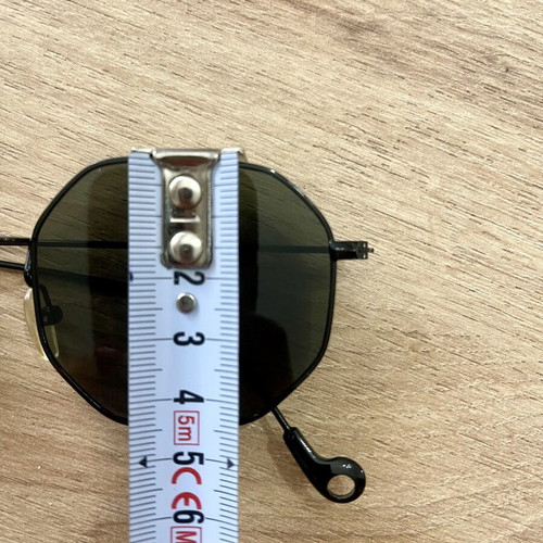 Polygonal statement sunglasses with asymmetrical design and strap