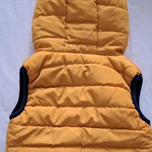 Baby sleeveless jacket used, yellow with blue lining