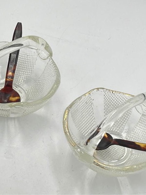Two small glass baskets with spoon for caviar used