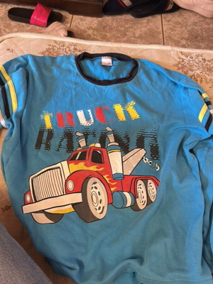 Minervakia pajama top like new, blue with truck print