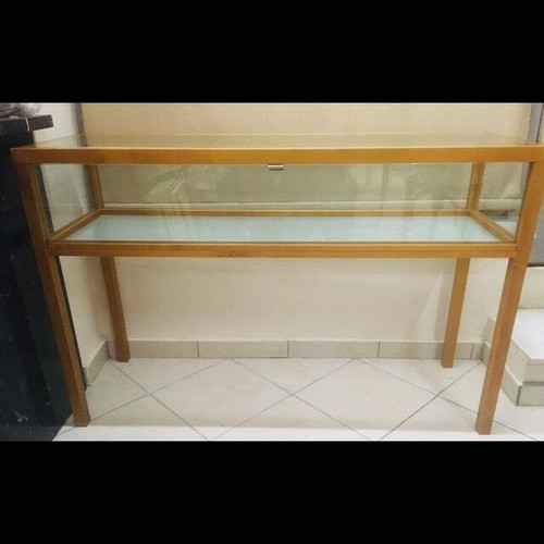 Console used with wooden frame and glass surfaces