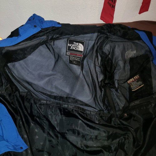 The North Face men's jacket used blue and black waterproof windbreaker