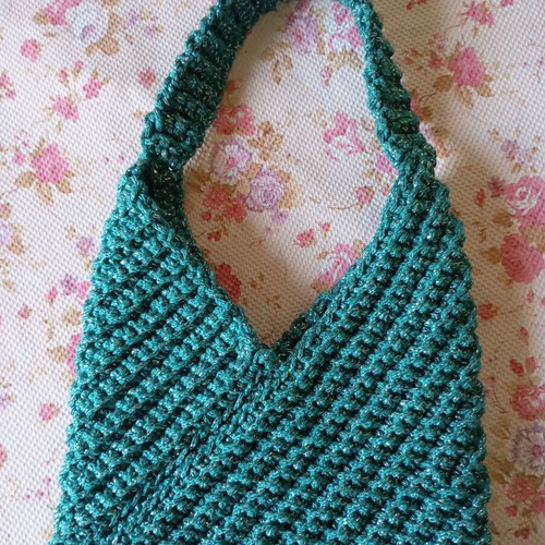 Handmade knitted handbag in turquoise green
