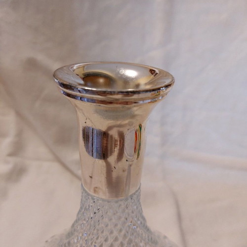 Crystal wine bottle used with silver-plated neck and stopper