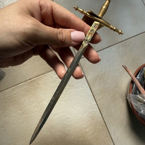 Vintage papercutter used, decorative sword design