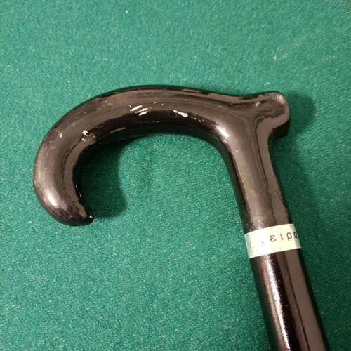 Wooden handmade cane used, black with wear marks