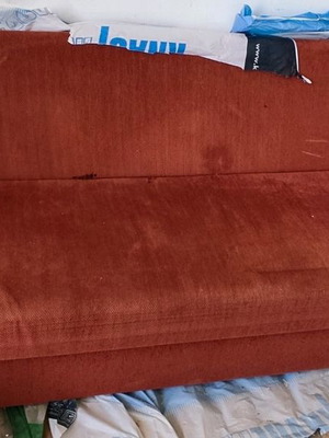 Three-seater sofa bed used with storage space