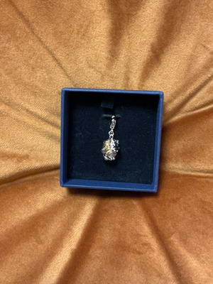 Swarovski lion charm like new, silver and gold