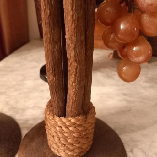 Handmade candlesticks used, set made of branches, rope and metal
