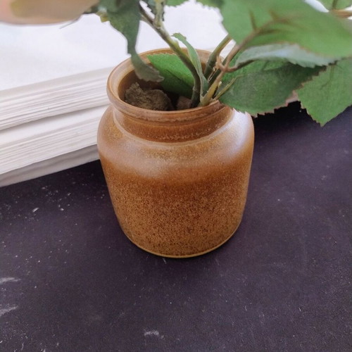 Decorative ceramic vase with artificial flowers used