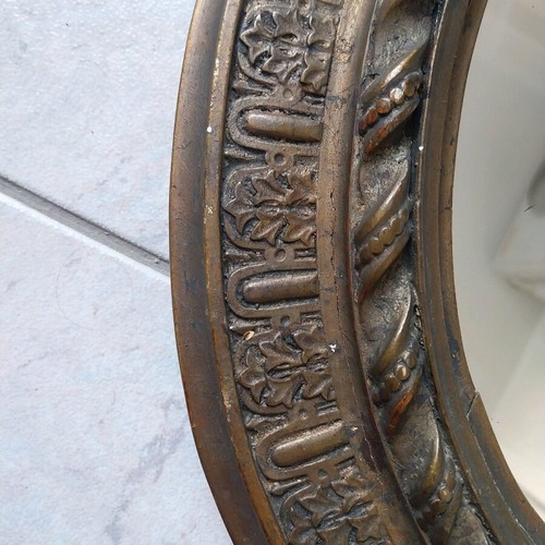 Oval mirror with carved wooden base, vintage