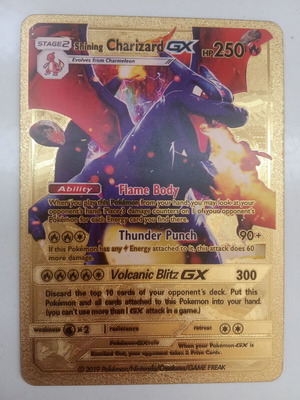 Pokémon Charizard card gold metal collectible used