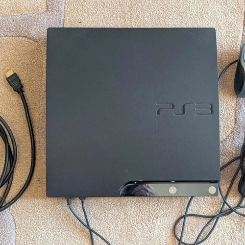 PlayStation 3 Slim used with 2 controllers and PES 2015 game