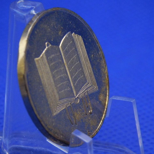 Commemorative metal token with Prince Rainier and Grace Kelly of Monaco