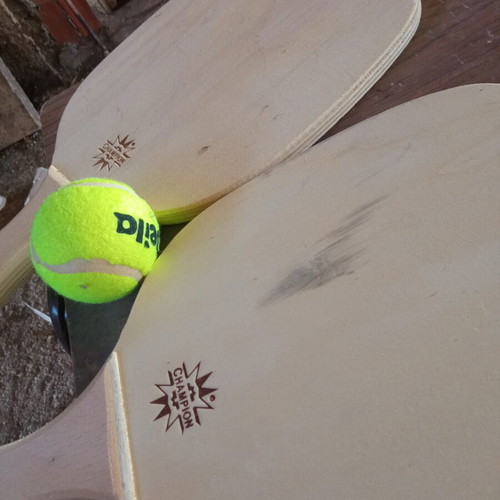 Wooden rackets with ball used, minor imperfections