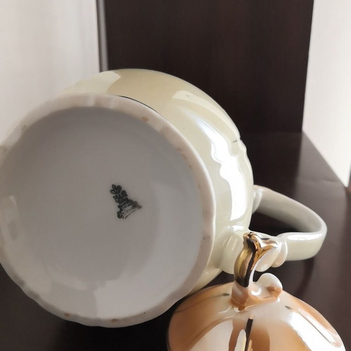 Porcelain teapot with opalescent surface and gold decoration