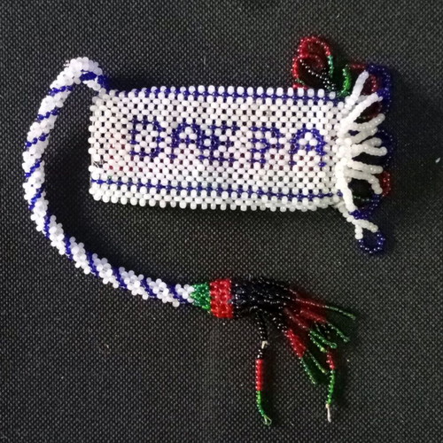 Beaded knitted case used, possibly for lighter or perfume bottle