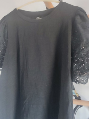 Black blouse with embroidered sleeves