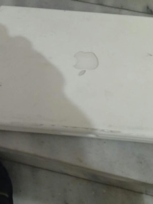 Apple MacBook white laptop