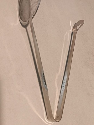 Handheld strainer tong like new, unused