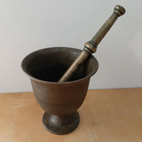 Old mortar with pestle used, vintage decoration