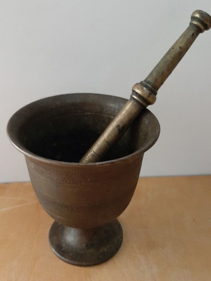 Old mortar with pestle used, vintage decoration