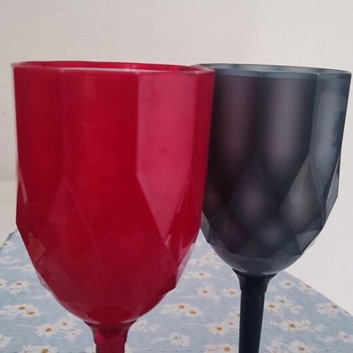 Plastic cups two, red and black, used