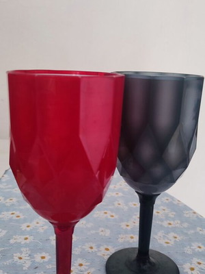 Plastic cups two, red and black, used