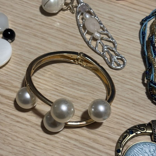 Jar treasure with assorted women's jewelry and accessories