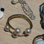 Jar treasure with assorted women's jewelry and accessories
