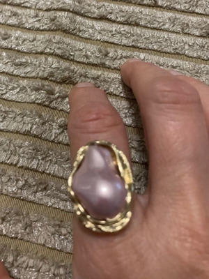 Steel ring like new with soft pink and gold color