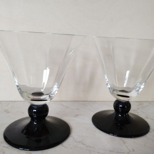 Vintage thin-walled glass glasses with black stem used, retro style