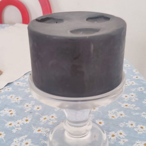 Black candle with transparent glass candlestick used