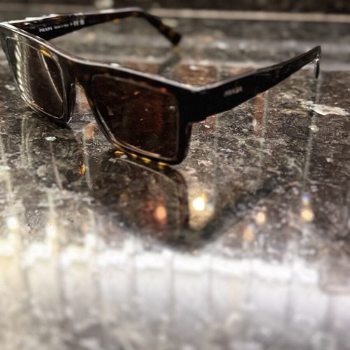 Prada sunglasses like new, unisex, black and brown