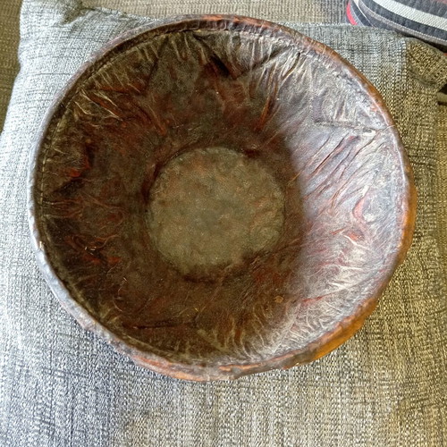 Antique carved wooden bowl with leather lining used