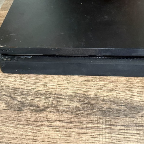 PlayStation 4 Slim 500GB used with 2 DualShock 4 controllers and accessories