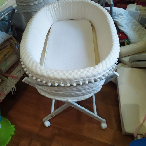 Bassinet on wooden base with wheels like new