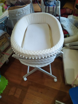 Bassinet on wooden base with wheels like new