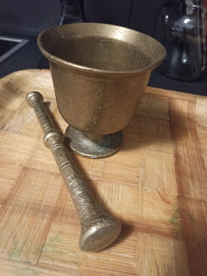 Brass mortar and pestle refurbished with greenish tones