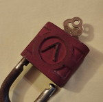 Old padlock used with key and skeleton key