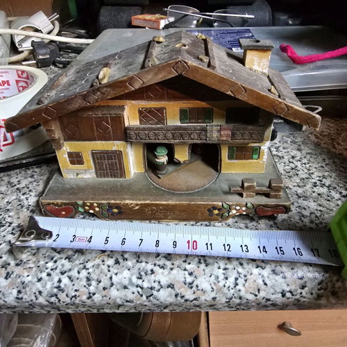 Vintage alpine wooden house used with figures