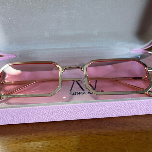 Av sunglasses used with pink lens and gold frame