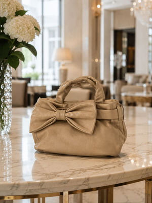 DKNY Gold Bow Handbag like new, beige metallic finish
