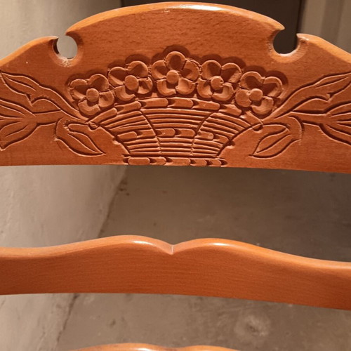 Wooden chair used with cane seat and embossed wood