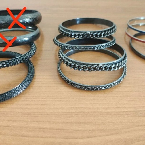 Stacking bangle bracelets used, 7 black metal and 2 colored